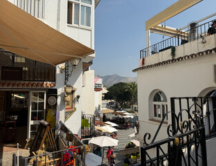 Fototapeta premium boutiques and stairway in the centre of the old town of Mijas, a historic town in the mountains of Andalusia between Marbella and Malaga, Fuengirola, Benalmadena, Costa del Sol, Spain
