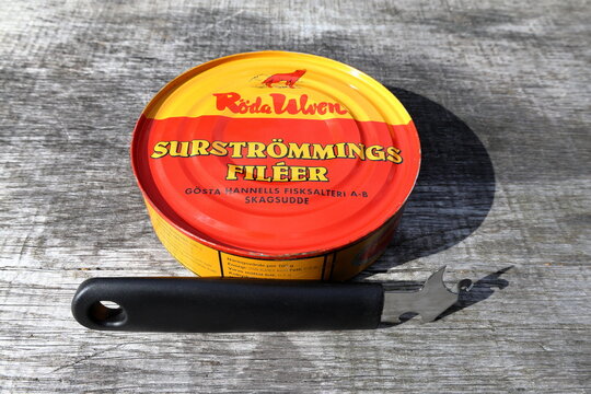 Sour herring tin with can opener. Called surstr&ouml;mming in Swedish. From R&ouml;da Ulven. Eat outside.  Stockholm, Sweden.