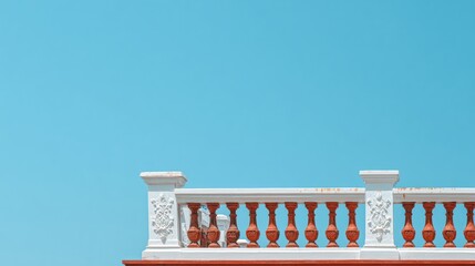 Naklejka premium Bright Blue Sky Contrasts With Ornate White Balcony Railing Overlooking Serene Landscape in Midday Sunlight