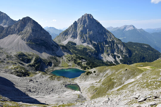 Mountain panorama of the Austrian Alps. Mieming Range under bright sunlight with clear blue sky and rocky peaks.