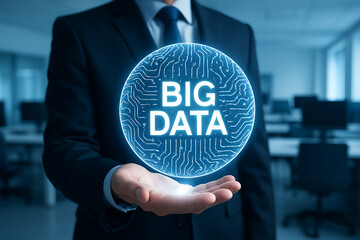 A professional businessman holds a digital hologram of big data in his hand, representing the concept of big data analysis