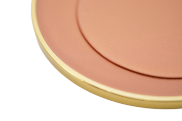 Close up of a round pink blush compact with a gold rim isolated on transparent background
