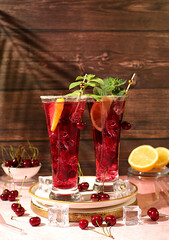 Sangria or cocktail with mint, cherry, soda, lemon and ice, a recipe for a refreshing summer and autumn drink, a detox diet and weight loss concept, a restaurant and bar menu. Cold homemade lemonade