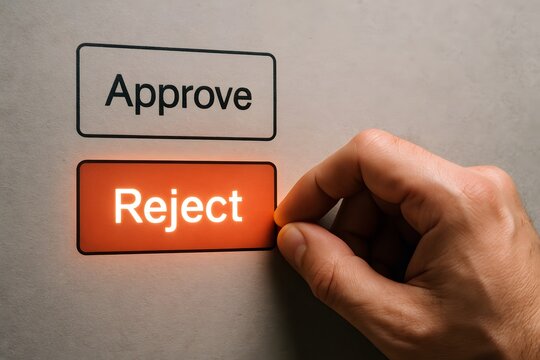 Hand choosing to reject on screen. 