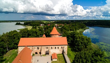 Obraz premium High-angle view of a medieval castle complex by a lake