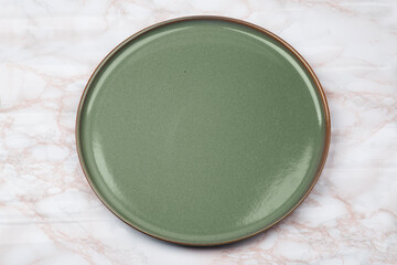 Empty ceramics plates, Classic dark green plate isolated on white background