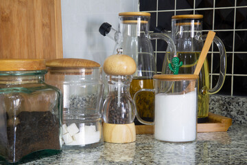 Marble stone stand on kitchen table with various food ingredients