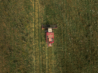 Aerial View of Red Harvester in Green Field Near Minsk, Belarus