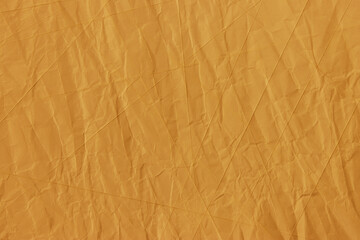 Fototapeta premium Abstract wrinkled golden crumpled paper texture background