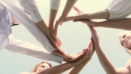 A harmonious circle of hands symbolizing teamwork, collaboration, and unity in a positive...