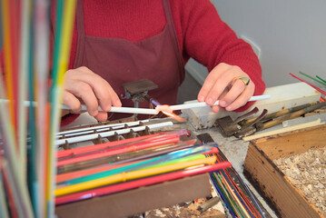 Murano glass artisan shaping glass with torch