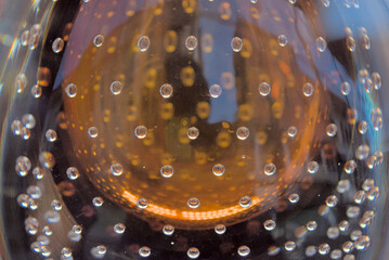 Macro of Murano glass with amber core and air bubbles