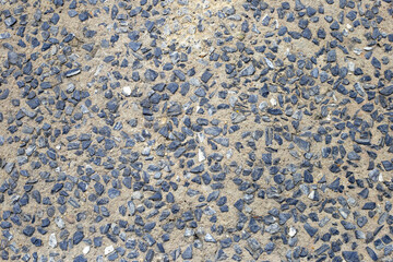 Outdoor rocks with cement walkway surface