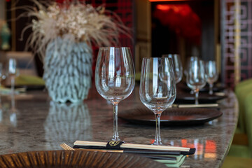 Elegant dining room with natural light and arranged tables