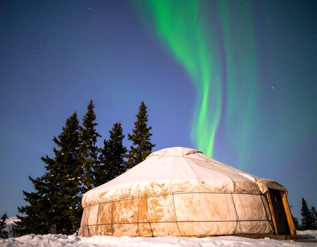 Aurora borealis over yurt