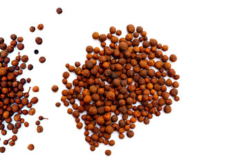 Brown dried allspice spice seeds.