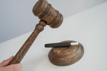 Judge's gavel and electronic cigarette. Tobacco heating system. 