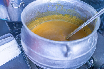 Pot of Nigerian Gbegiri soup served at party
