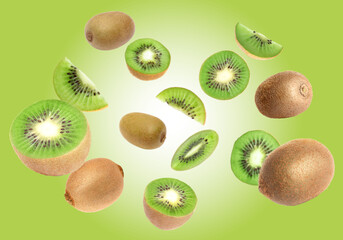 Fototapeta premium Tasty fresh kiwi fruits swirling in air against green gradient background