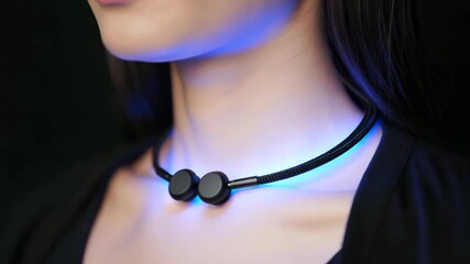 Neck vibration therapy device, wearable relaxation gadget, resonance wellness tool, modern stress relief, innovative health technology, blue light therapy accessory - Powered by Adobe