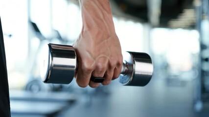 Smart ring for fitness tracking, athlete lifting dumbbell, wearable health technology, digital strength monitoring, gym performance accessory, modern workout innovation - Powered by Adobe