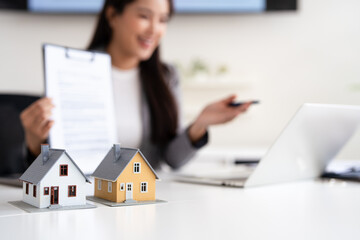 Asia business woman professional real estate sale agent talking explaining business contracts,...