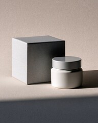 Cream jar and cube box, soft lighting, neutral background