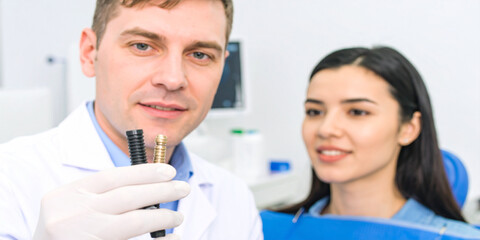 Dental Implant Consultation Dentist Explaining Procedure to Patient with Model