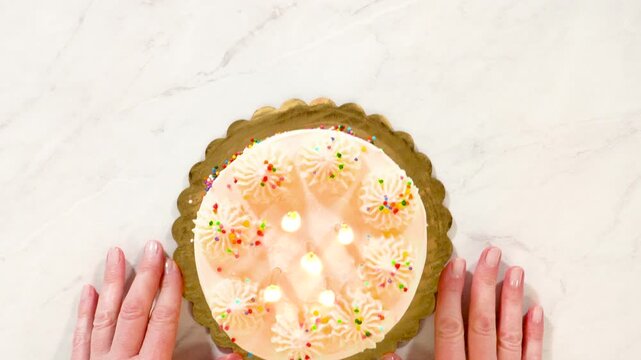 Decorated birthday cake with symmetrical sprinkle pattern