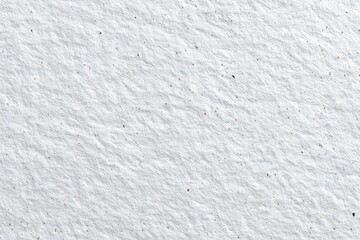Obraz premium Close-up view of textured, off-white paper with subtle, scattered speckles