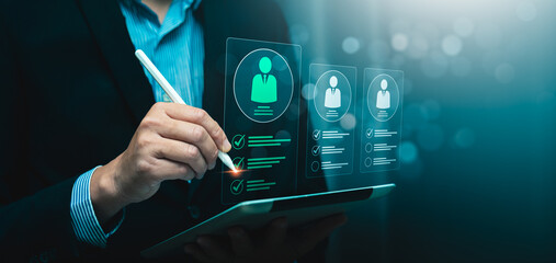Digital recruitment and candidate selection concept with businessman using stylus to evaluate virtual resume profiles on tablet, symbolizing hiring process, HR technology, employee screening checklist