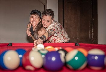 young couple playing pool
