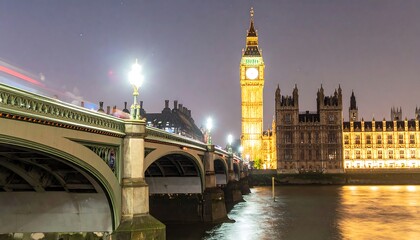 Naklejka premium A nighttime view of the Houses of Parliament and Big Ben, illuminated by the glow of city lights, reflected in the calm waters of the Thames River, with an old-fashioned bridge in the foreground.