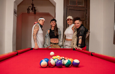 young women playing pool