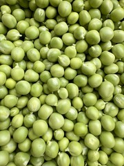 Healthy organic green peas background natural vegetarian protein food macro view