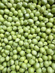 Healthy organic green peas background natural vegetarian protein food macro view