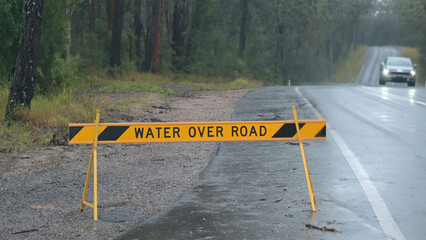 Water over road warning traffic sign