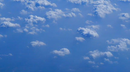 Blue sky fluffy white clouds on summer season bright clear skyline with beautiful cloudscape. Panorama blue sky clouds pattern on daylight with copy space. Cumulus cloudscape air climate sunny day