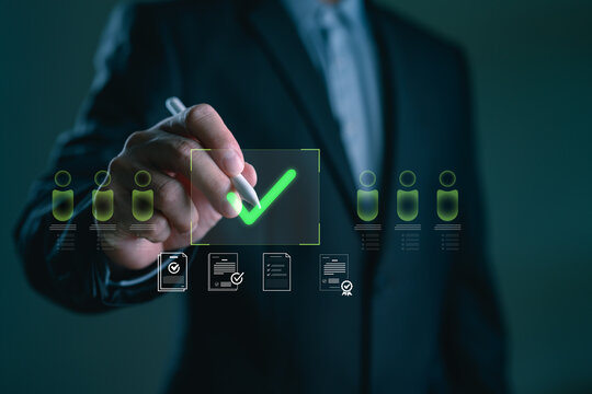 Businessman selecting a candidate with a green check mark on a virtual interface, concept of hiring approval, digital recruitment system, employee evaluation and HR management technology.