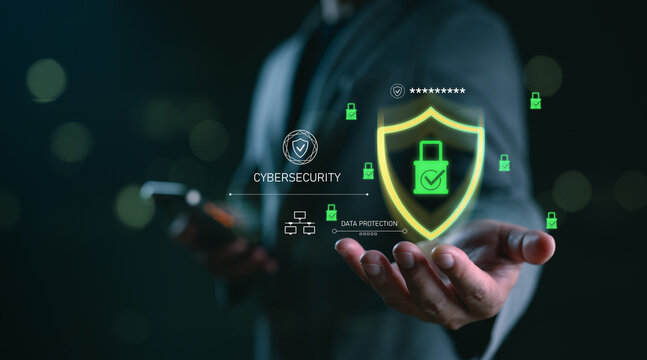 Cybersecurity and data protection concept with businessman holding glowing shield and padlock icon, representing secure network, encryption, digital safety, privacy system and online threat defense.