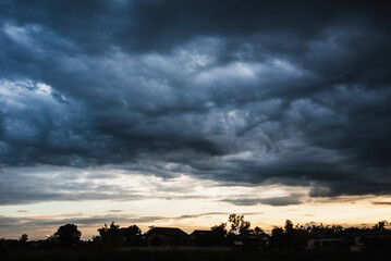 Dramatic dark storm thundercloud rain clouds on black sky background. Dark thunderstorm clouds rainny landscape. Meteorology danger windstorm disaster climate. Dark cloudscape storm disaster gray sky