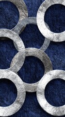 Interlocking metallic rings on a dark blue textured background
