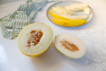 Canary and Snow Leopard Melon on Quartz Counter