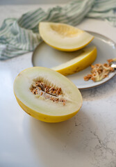 Canary and Snow Leopard Melon on Quartz Counter