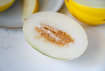 Canary and Snow Leopard Melon on Quartz Counter