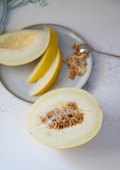 Canary and Snow Leopard Melon on Quartz Counter