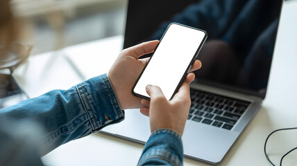 Modern professional working with phone and laptop for marketing content creation