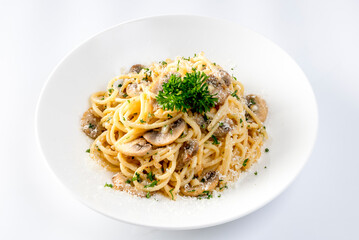 Spaghetti with Mushroom Cream Sauce in White Ceramic Plate