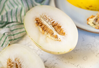 Canary and Snow Leopard Melon on Quartz Counter