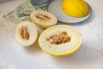 Canary and Snow Leopard Melon on Quartz Counter